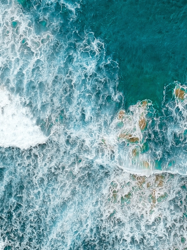 An aerial photograph of waves on the ocean