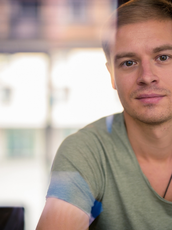 Image of a young man looking to camera